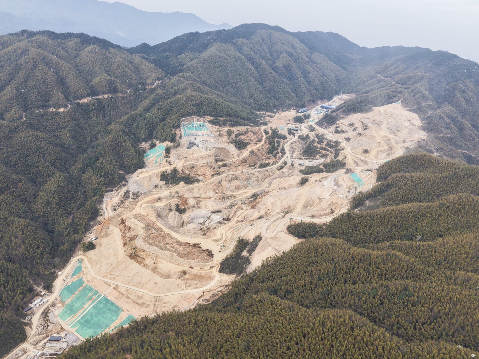 Earthwork excavation and benches with haul roads around the site