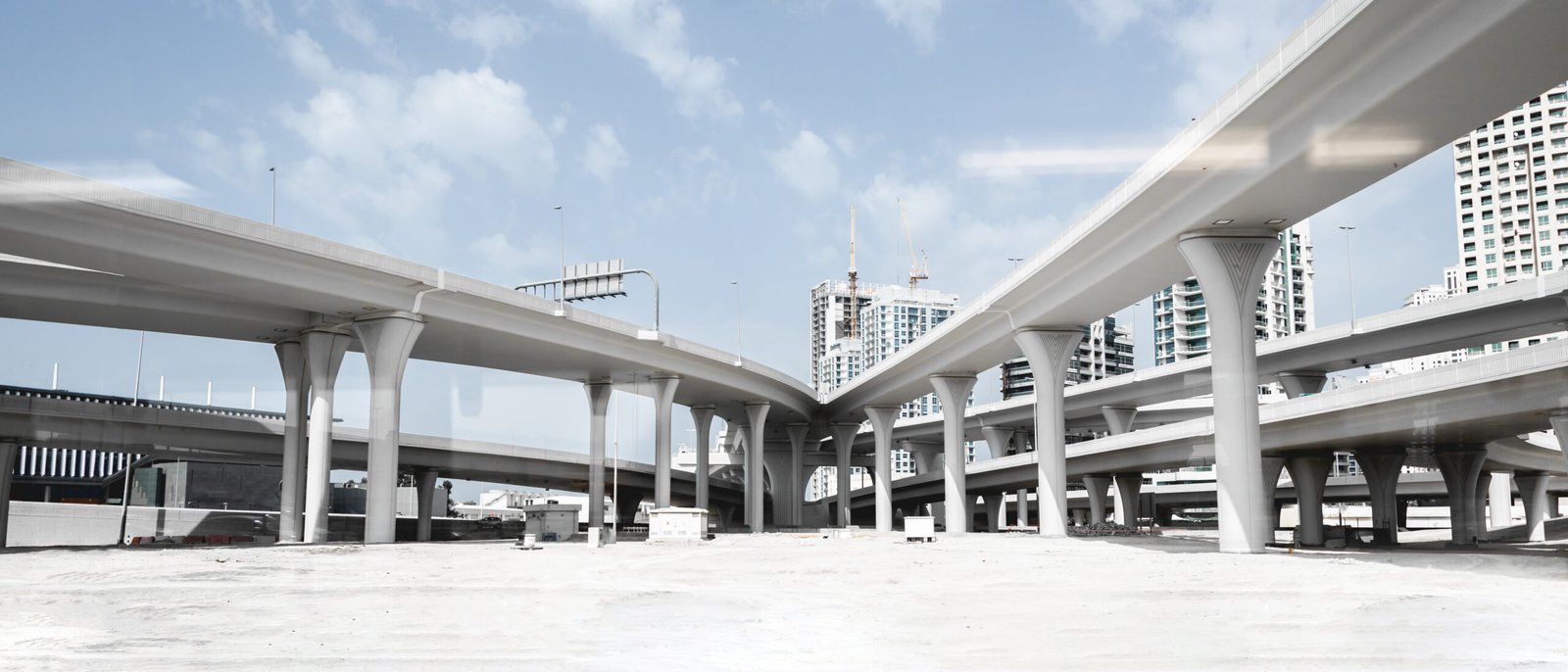 Multi-level highway interchange with bridge decks and approach slabs