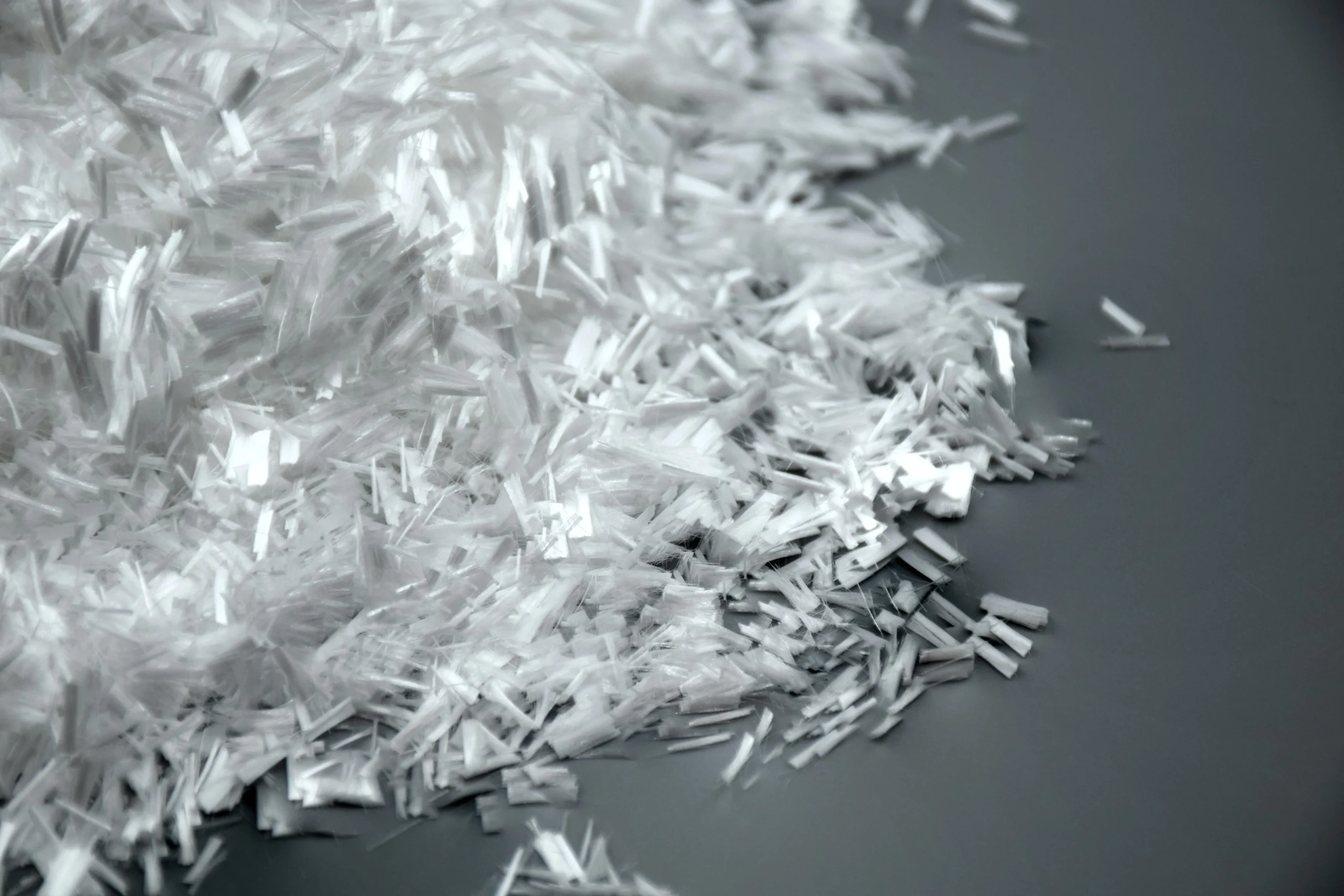 Close-up view of polypropylene fibers used to control cracking and improve toughness in concrete